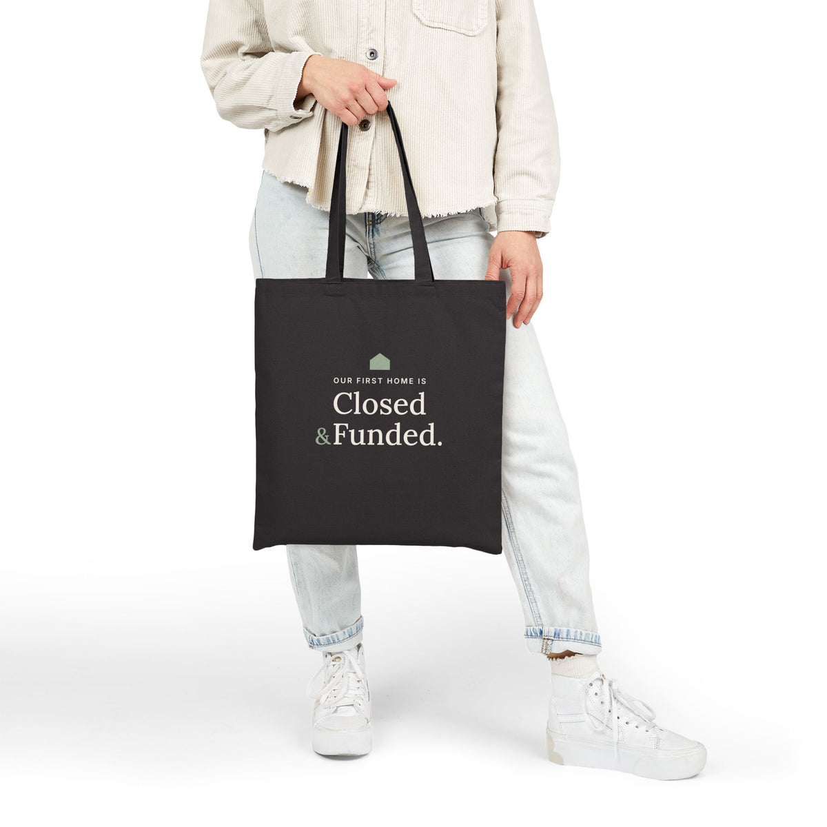 Black Our First Home Is Closed & Funded tote carried by a new homeowner